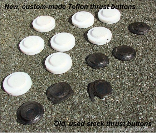 new teflon (white) vs. old rubber-like (black) thrust buttons